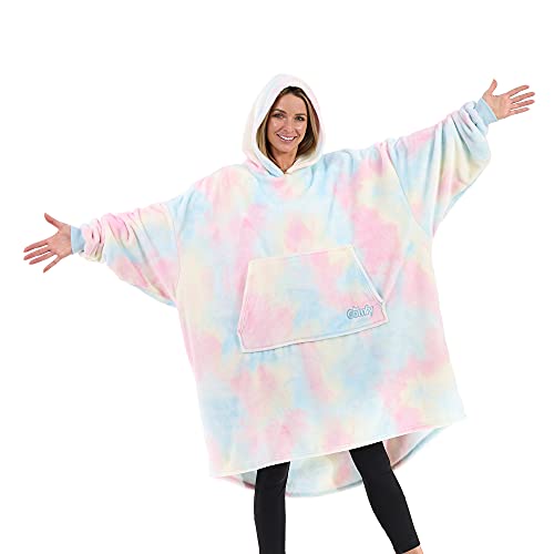 Woman wearing a colorful blanket like an oversized hoodie