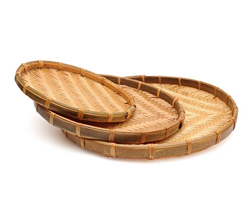 A set of three handwoven bamboo serving trays from Vietnam