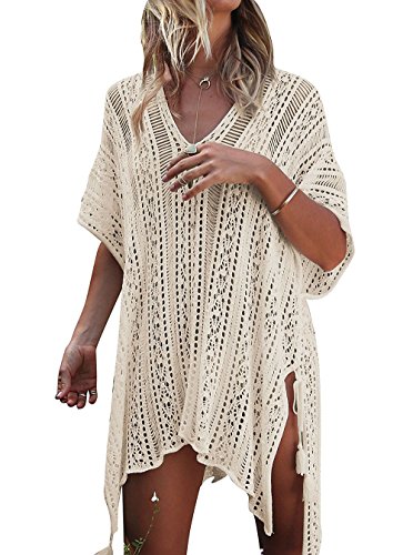 A woman wearing a white knitted cover up for the beach