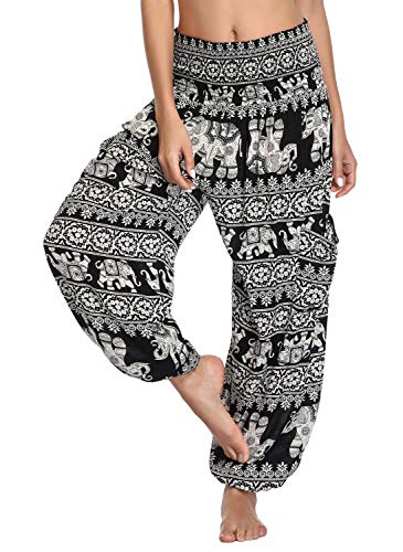 Woman wearing comfy pants with a pattern of elephants