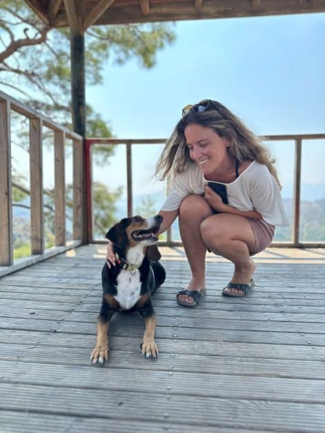 A photo of a woman and a dog