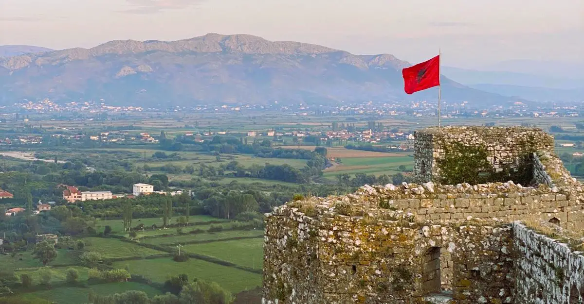 A castle in Albania with the Albanian flag