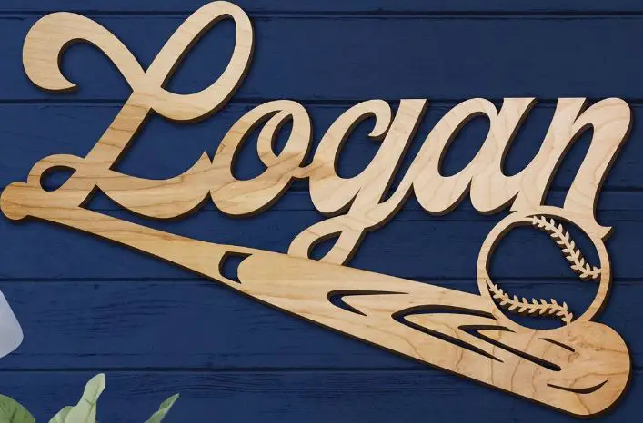 A wooden sign with a name and a baseball bat