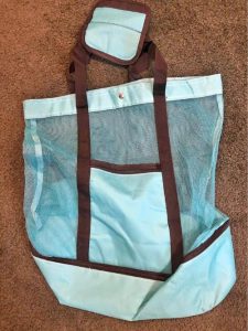 A ebach bag with a compartment for cooling at the bottom
