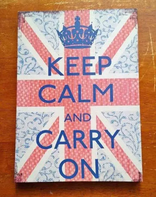 A sign with the British flag and "keep calm and carry on"
