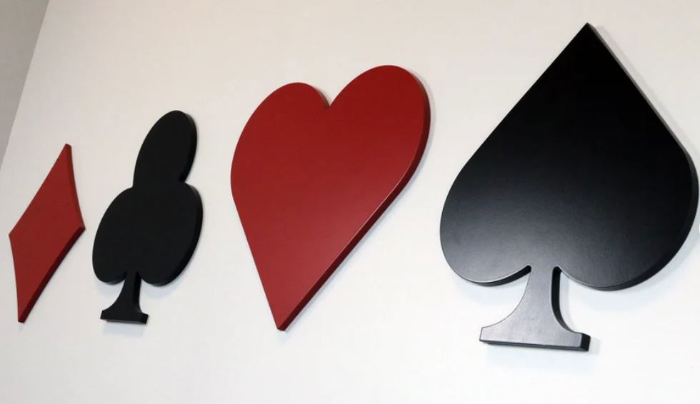 Wooden wall decor of playing card suits