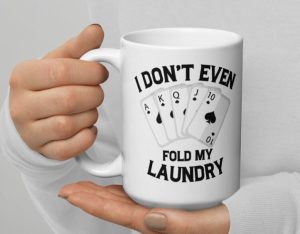 A white coffee mug with "I don't even fold my laundry"