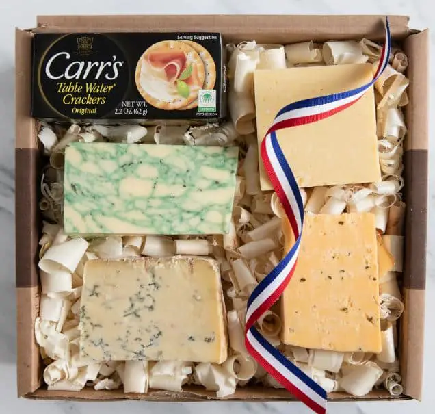 A cheese gift basket with different cheeses from the UK