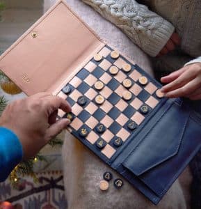 A chessboard in a leather bag