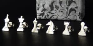 Stud earrings in the shape of chess pieces