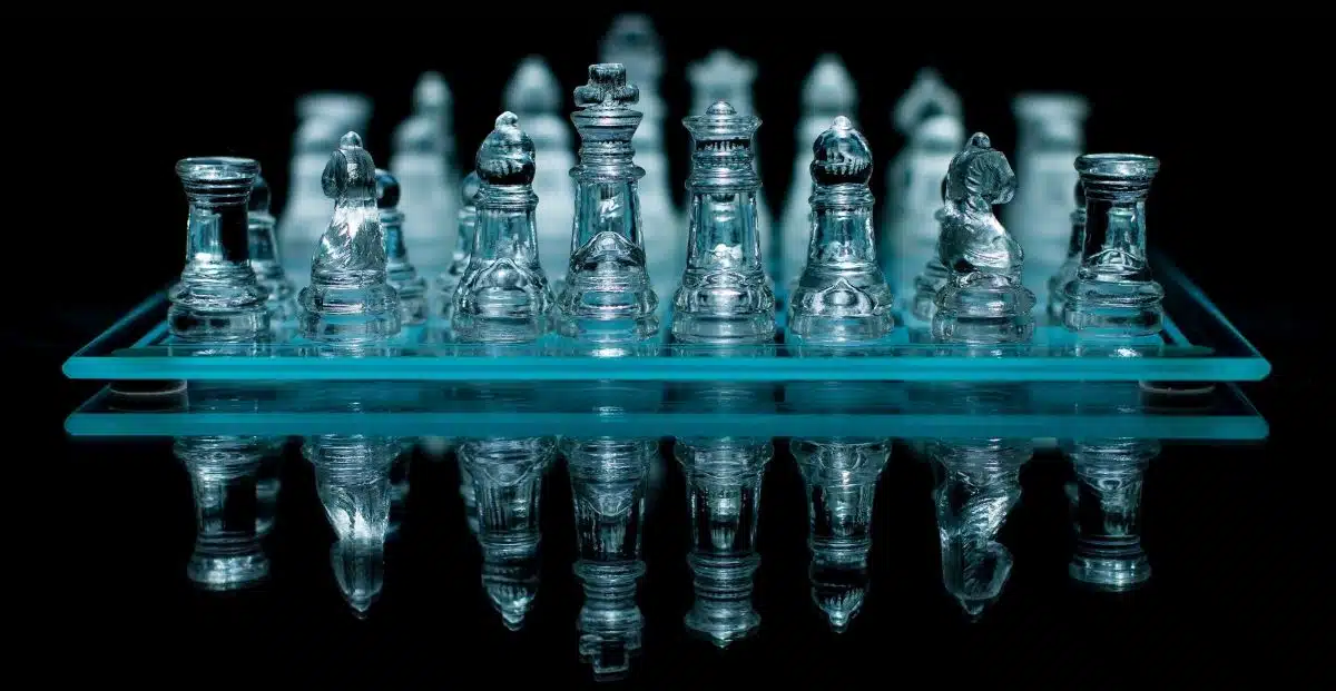 A glass chessboard with glass chess pieces
