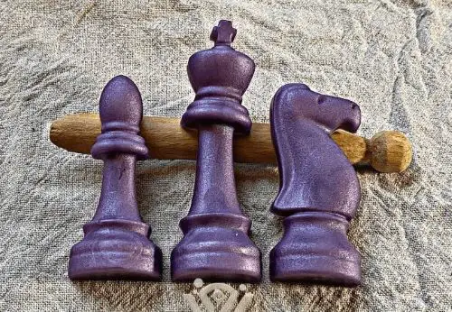 Three pieces of soap in the shape of chess pieces