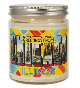 A candle with a label "greetings from Chicago, Illinois"
