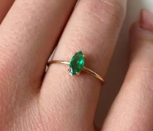 A ring with a gemstone of emerald