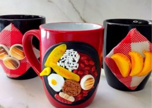 Three mugs with typical Colombian food printed