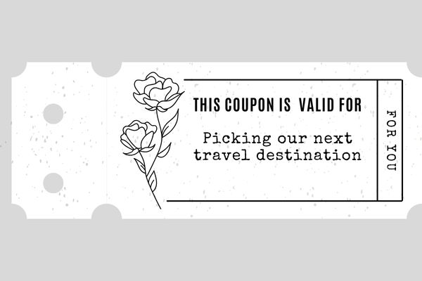A white selfmade coupon for "picking our next travel destination"