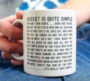 A mug with a long funny text explaining that cricket is an easy sport