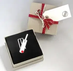 A box with cricket-themed socks