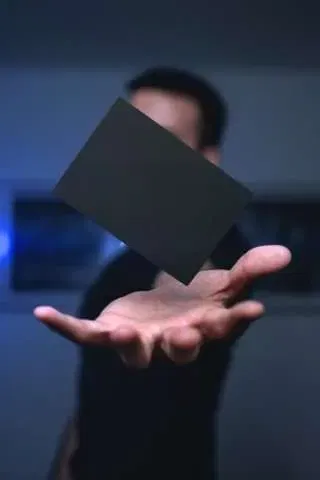 Men holding a card in the air
