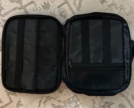 A black travel cord organizer