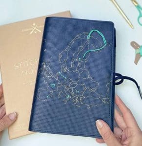 A leather passport cover with the map of Europe and the option to sticht it