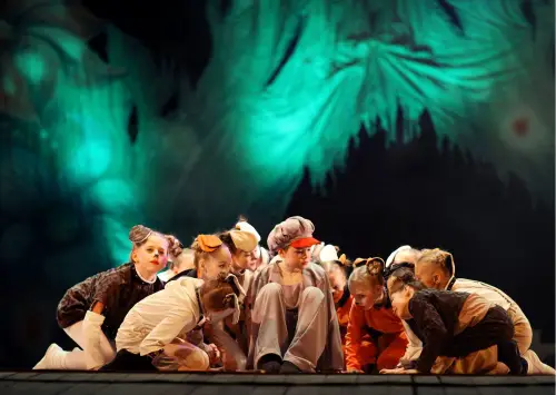 Children performing a play on stage