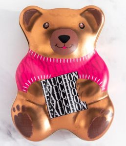 A tin box in the shape of a bear from a French chocolate brand