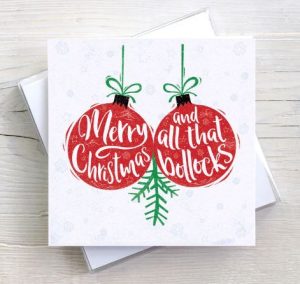 Two Christmas balls and "Merry Christmas and all that bollocks"
