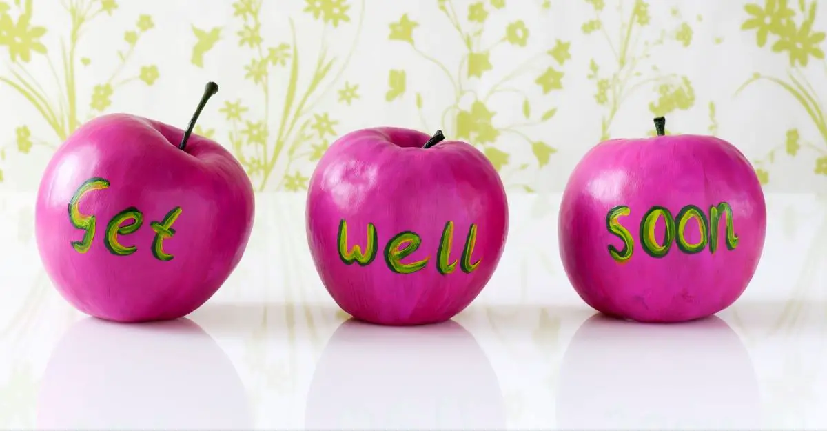 Three pink apples with the words "get well soon"