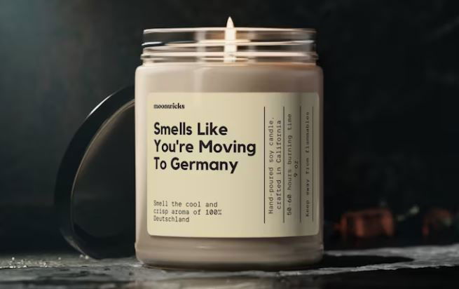A candle with the label "Smells like you're moving to Germany"