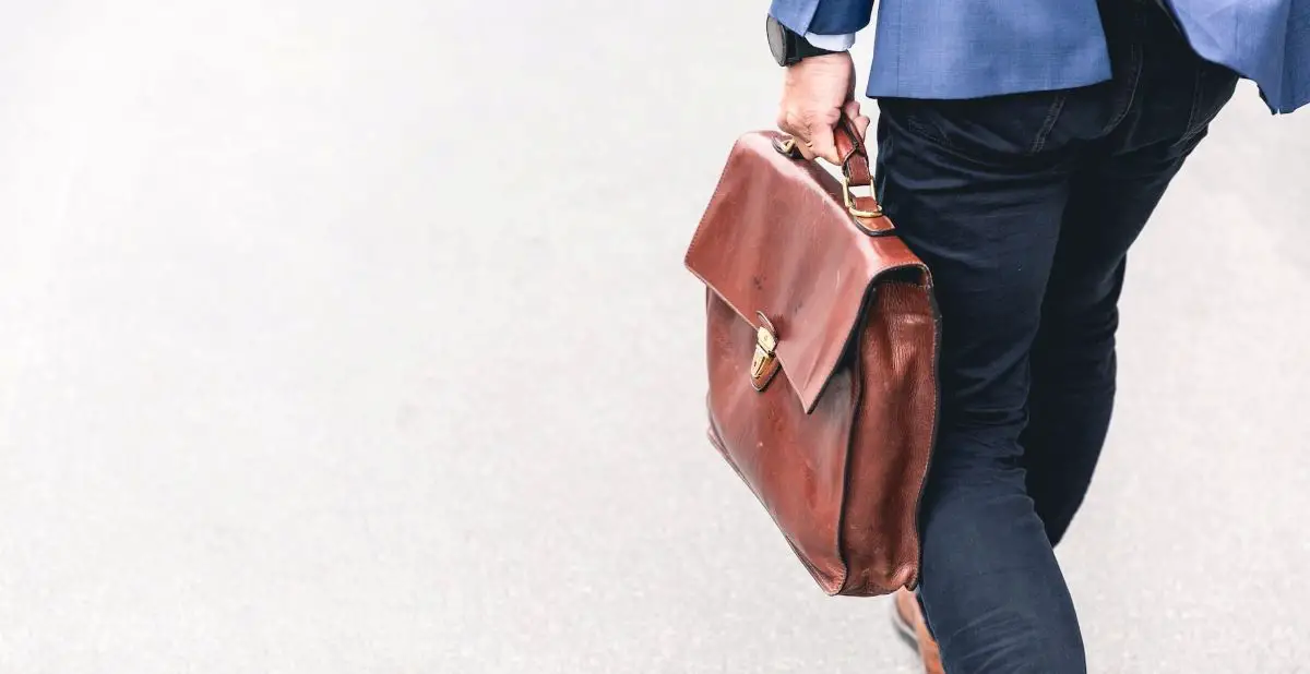 Person walking with busine case