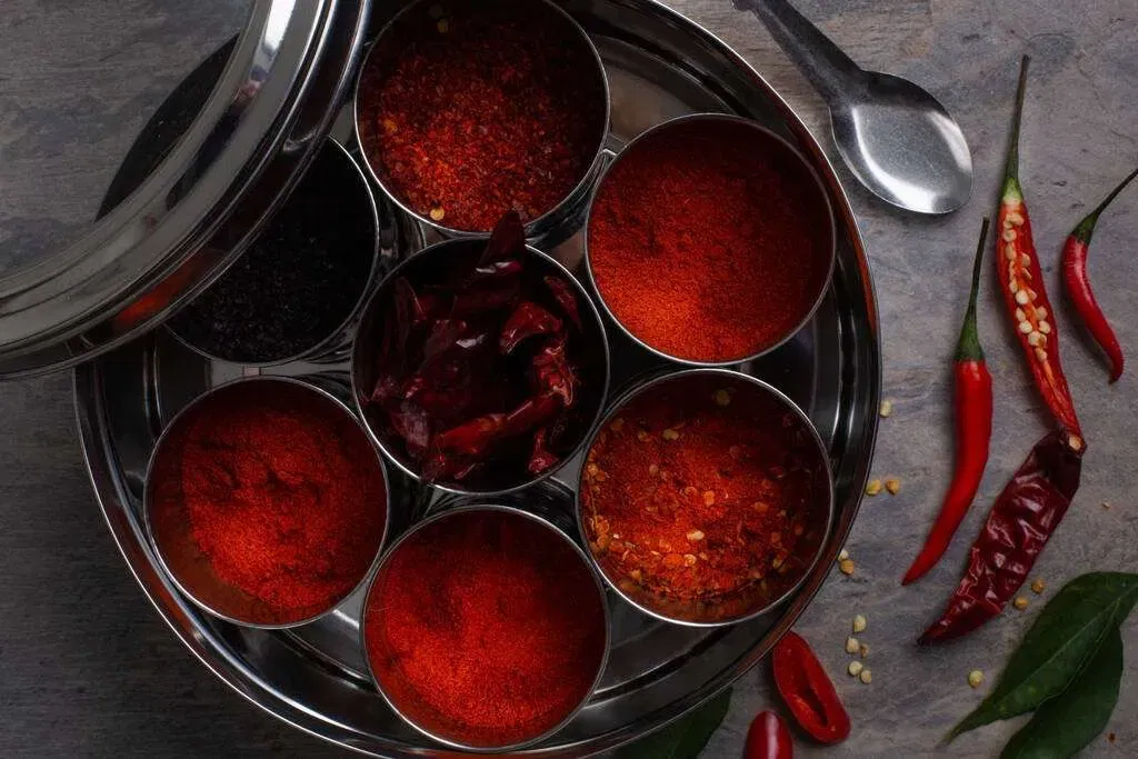7 cans with red chili