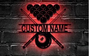 Wall art made from metal in the shape of billiard balls and cue and a custom name plus led light in the background