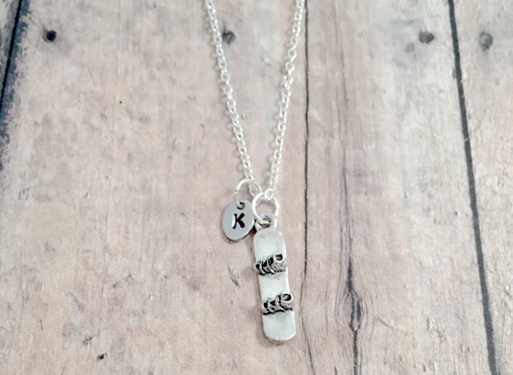 Necklace with a pendant of a snowboard
