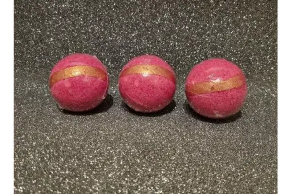 A set of three bath bombs in pink