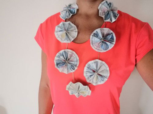 Woman wearing a necklace made from money