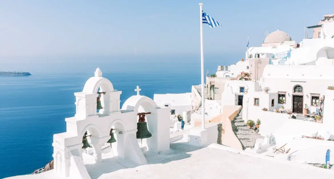 White building and flag of Greece