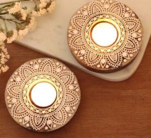 Two handmade candle holders from India