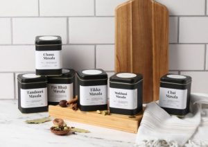 A set of six containers with Indian spices