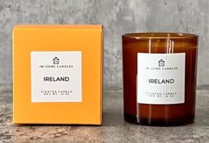 A scented candle with a label from Ireland