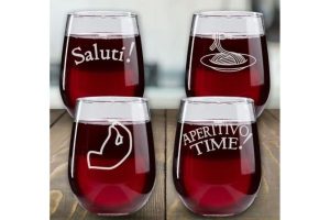 A set of four wine glasses with Italian phrases etched