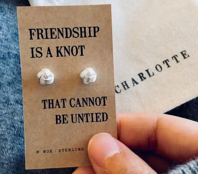 Two knot earring studs with the text "friendship is a knot that cannot be untied"
