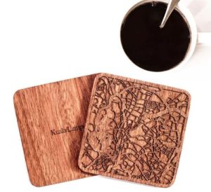 A wooden coaster with the map of Kuala Lumpur, Malaysia