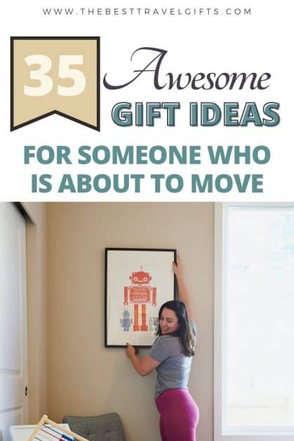 25 Awesome gift ideas for moving out of state with a photo of a woman hanging a poster on the wall