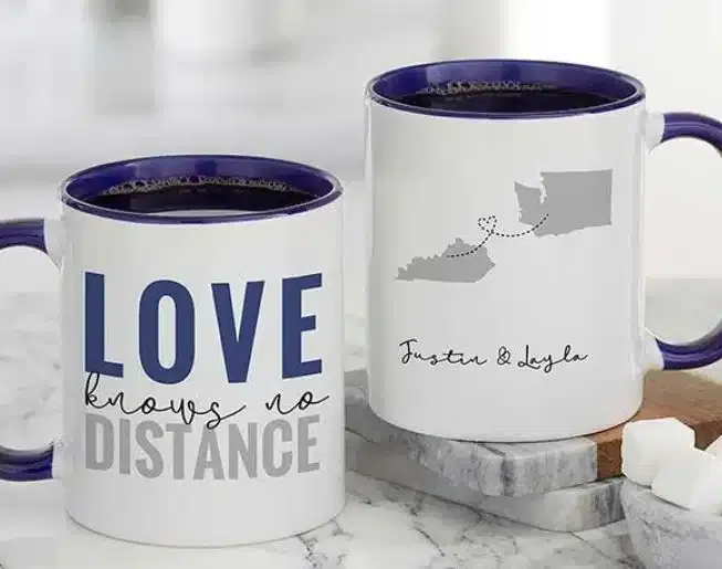 A mug wth US states and the text "love knows no distance
