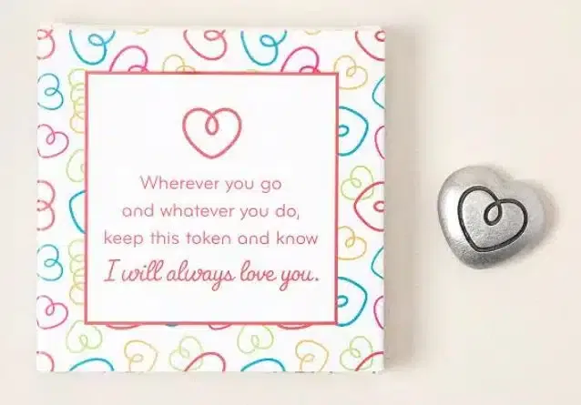A box with a metal heart and the text: Wherever you go and whatever you do, keep this token and know I will always love you