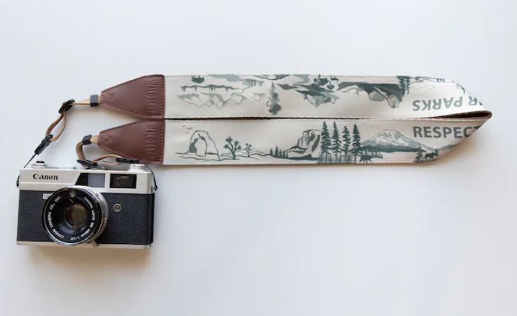 A cotton camera strap with a national park design