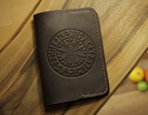 A leather passport cover with Viking written letters