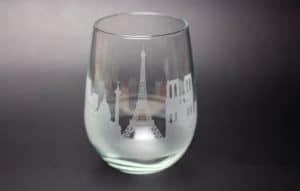 A glass with the skyline of Paris etched
