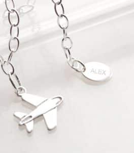 bracelet with plane and name tag